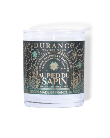 Bougie parfumée au pied du sapin