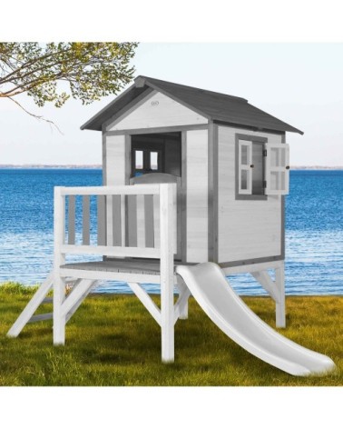 Maisonnette blanche sur pilotis avec toboggan blanc